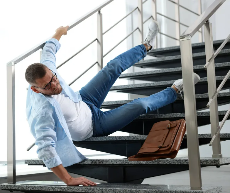 Person falling on an indoor staircase